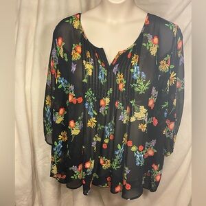 Torrid size 4 black, floral, semi sheer blouse with pleated detail.